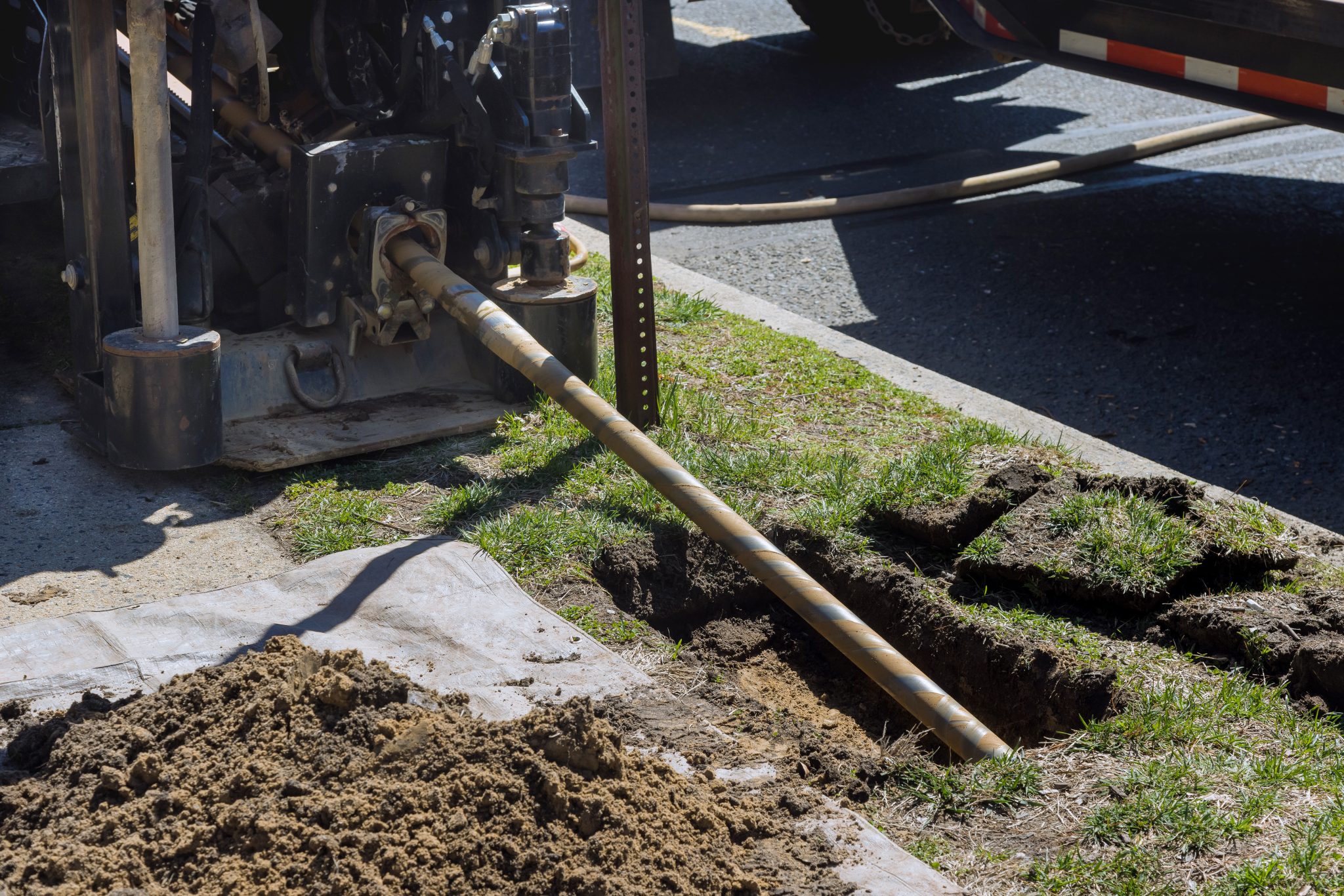 Low,Angle,View,Of,Trenchless,Laying,Of,Communications,,Fiber,Optic